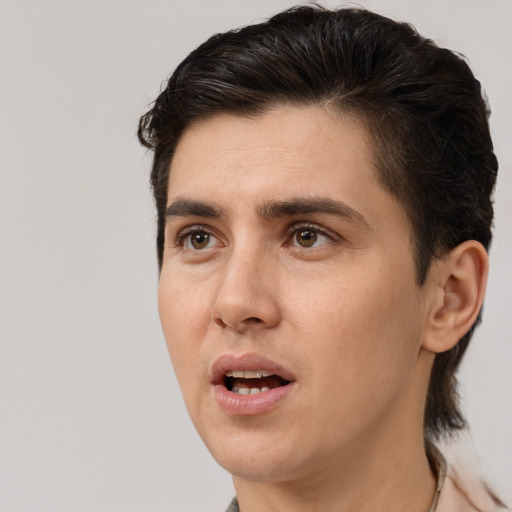 Joyful white adult male with short  brown hair and brown eyes