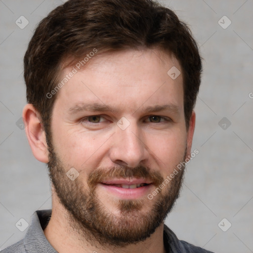 Joyful white adult male with short  brown hair and grey eyes