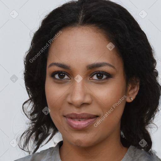 Joyful black young-adult female with long  brown hair and brown eyes