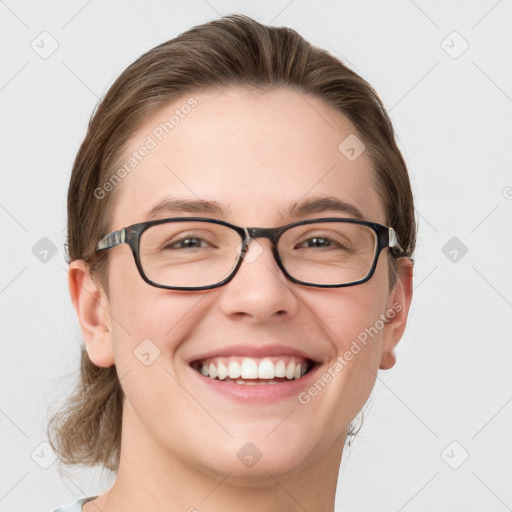 Joyful white young-adult female with medium  brown hair and blue eyes