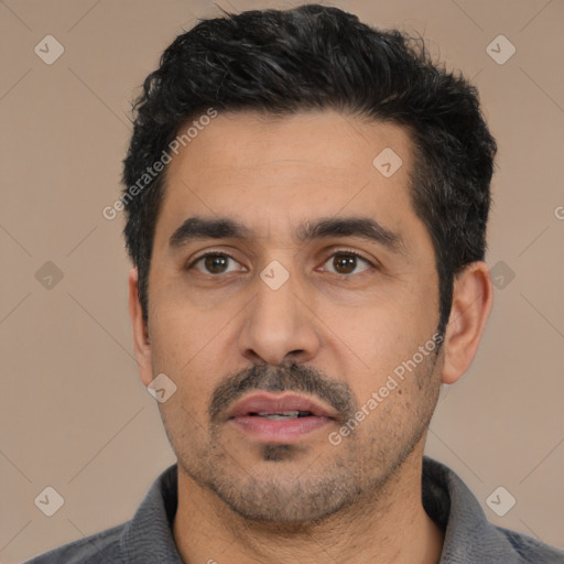 Neutral latino young-adult male with short  black hair and brown eyes