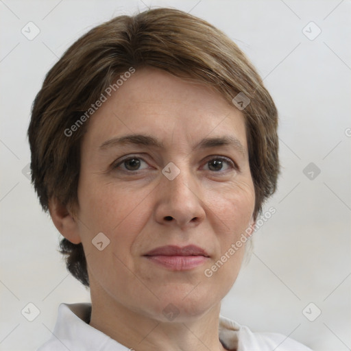 Joyful white adult female with short  brown hair and brown eyes