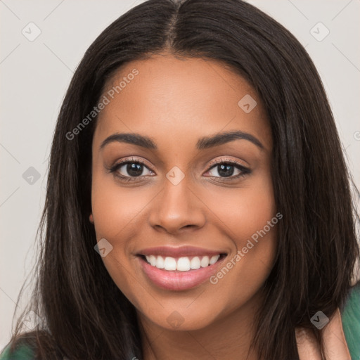 Joyful latino young-adult female with long  brown hair and brown eyes