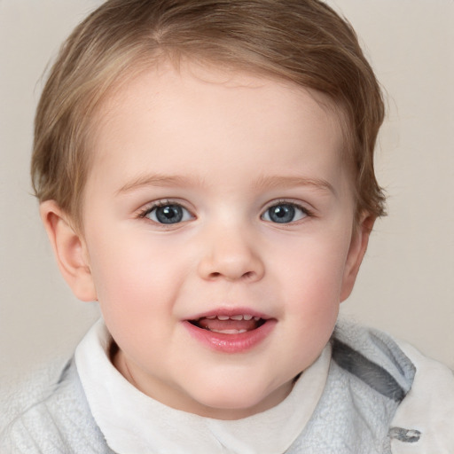 Joyful white child female with short  brown hair and blue eyes