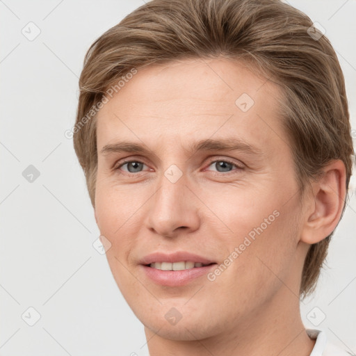 Joyful white young-adult female with short  brown hair and grey eyes