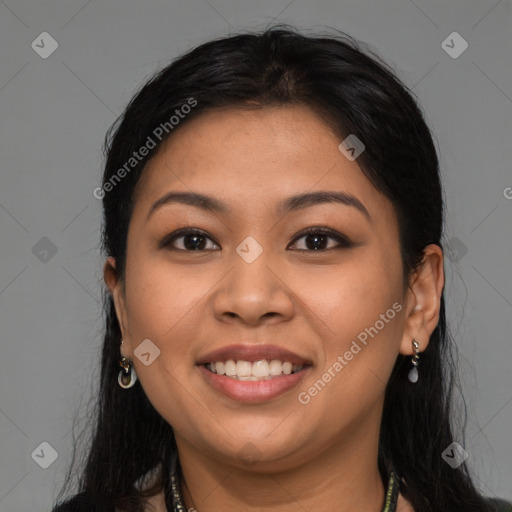 Joyful latino young-adult female with long  brown hair and brown eyes