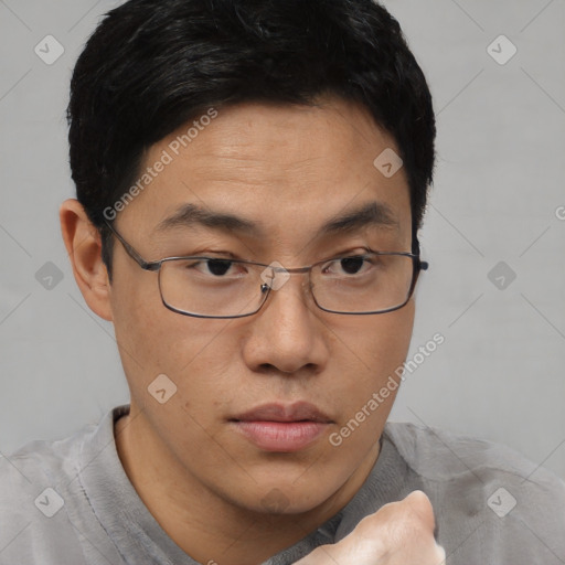 Neutral asian young-adult male with short  brown hair and brown eyes