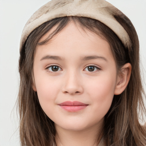 Joyful white child female with long  brown hair and brown eyes