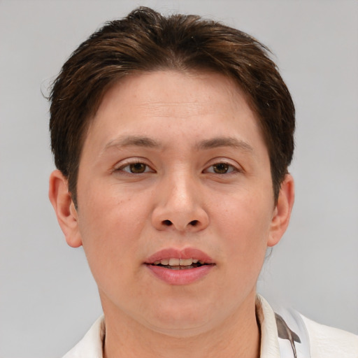 Joyful white adult female with short  brown hair and brown eyes
