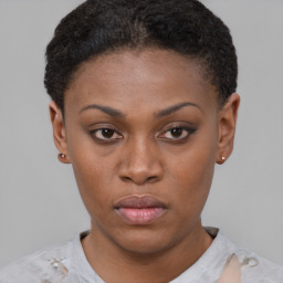 Neutral black young-adult female with short  brown hair and brown eyes