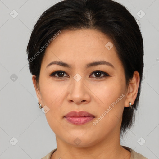 Joyful asian young-adult female with medium  brown hair and brown eyes