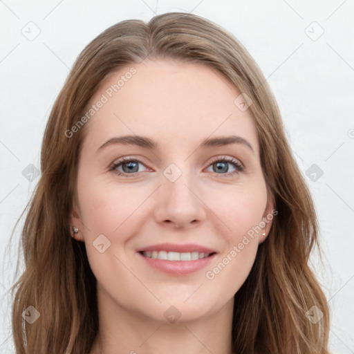 Joyful white young-adult female with long  brown hair and blue eyes