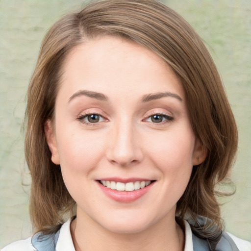 Joyful white young-adult female with medium  brown hair and blue eyes