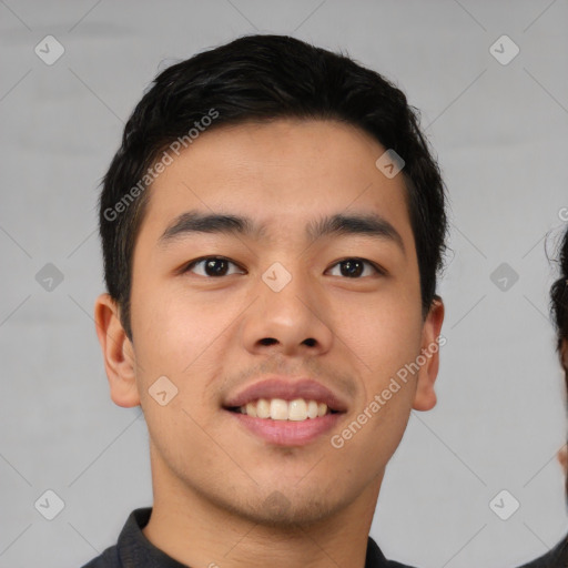 Joyful asian young-adult male with short  brown hair and brown eyes