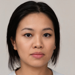 Neutral asian young-adult female with medium  black hair and brown eyes