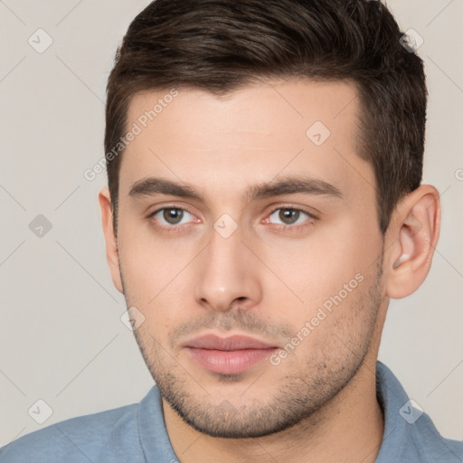 Neutral white young-adult male with short  brown hair and brown eyes