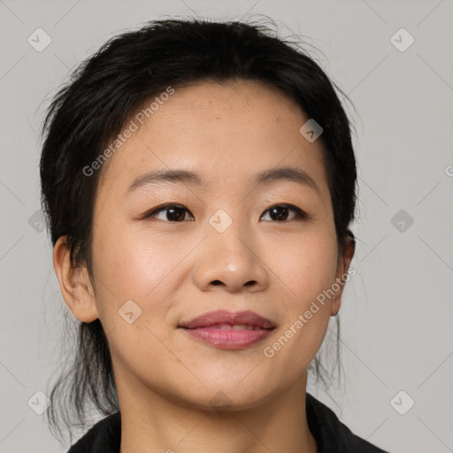 Joyful asian young-adult female with medium  black hair and brown eyes