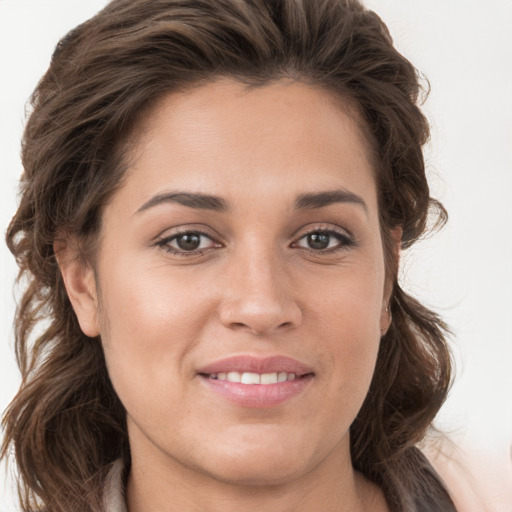 Joyful white young-adult female with long  brown hair and grey eyes