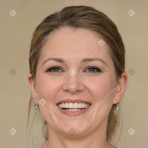 Joyful white adult female with medium  brown hair and grey eyes