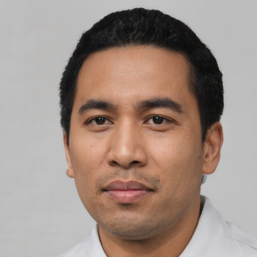 Neutral latino young-adult male with short  black hair and brown eyes