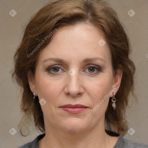 Joyful white adult female with medium  brown hair and grey eyes