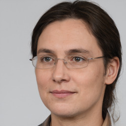 Joyful white adult female with medium  brown hair and brown eyes