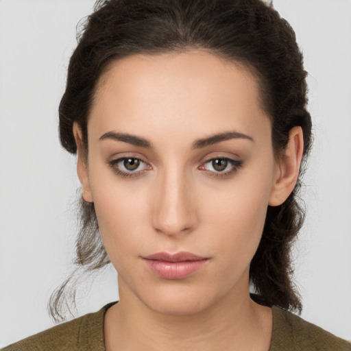 Neutral white young-adult female with medium  brown hair and brown eyes