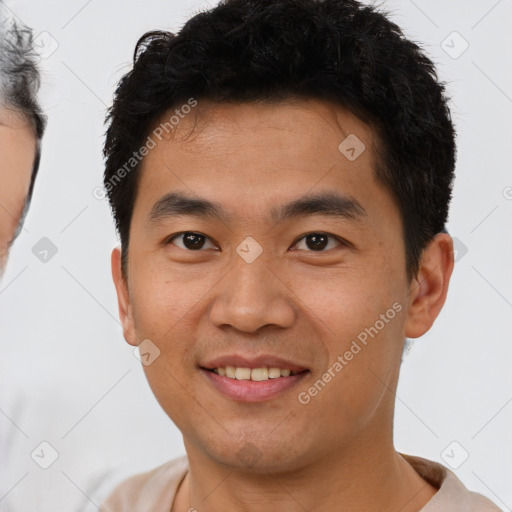 Joyful latino young-adult male with short  brown hair and brown eyes