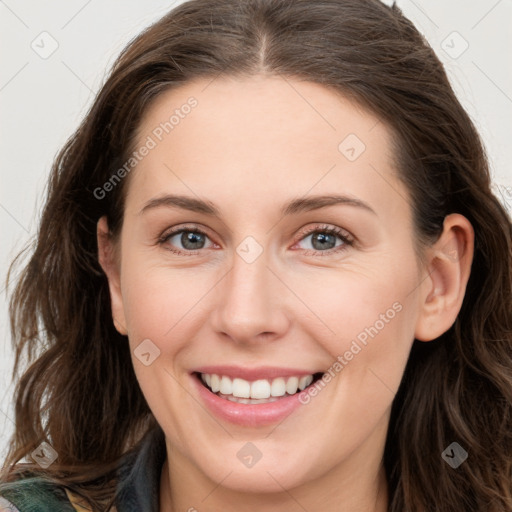 Joyful white young-adult female with long  brown hair and green eyes