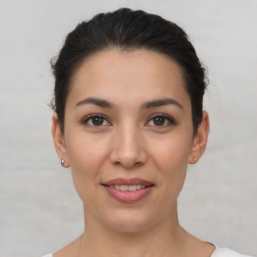 Joyful white young-adult female with short  brown hair and brown eyes