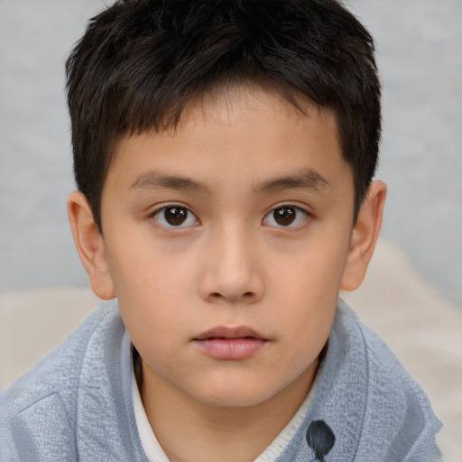 Neutral asian child male with short  brown hair and brown eyes