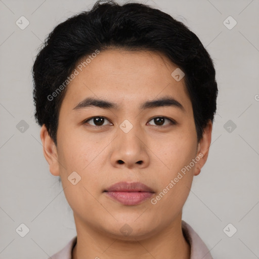 Joyful asian young-adult male with short  brown hair and brown eyes