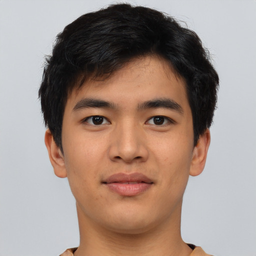Joyful asian young-adult male with short  black hair and brown eyes