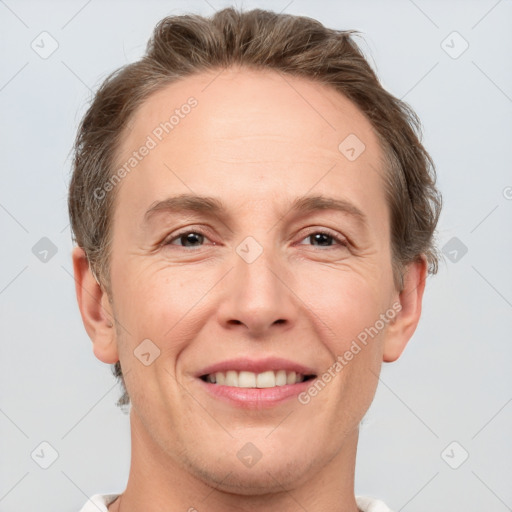 Joyful white adult male with short  brown hair and grey eyes