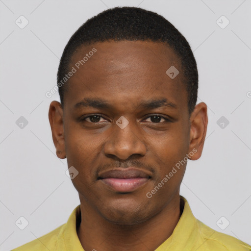 Joyful black young-adult male with short  brown hair and brown eyes