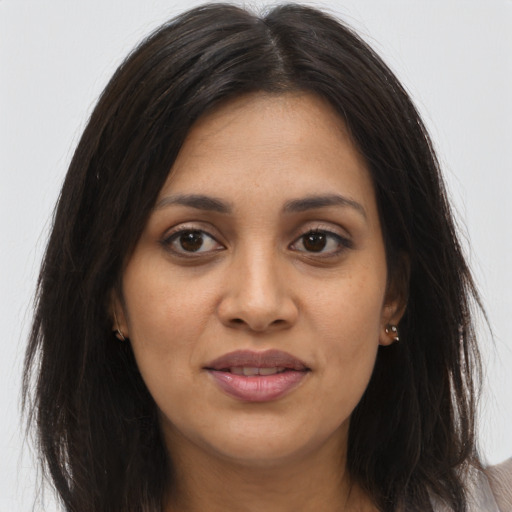 Joyful asian young-adult female with long  brown hair and brown eyes