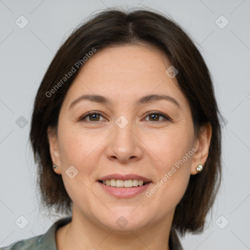 Joyful white adult female with medium  brown hair and brown eyes