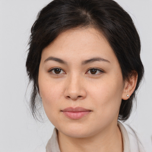 Joyful white young-adult female with medium  brown hair and brown eyes