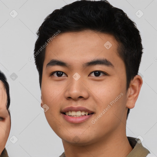 Joyful asian young-adult male with short  black hair and brown eyes