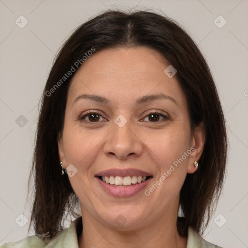 Joyful white adult female with medium  brown hair and brown eyes