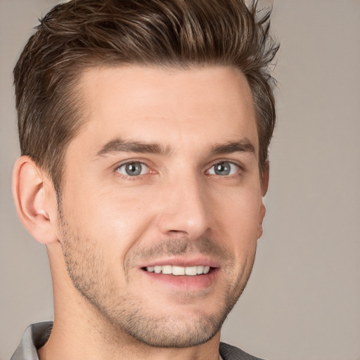 Joyful white young-adult male with short  brown hair and brown eyes