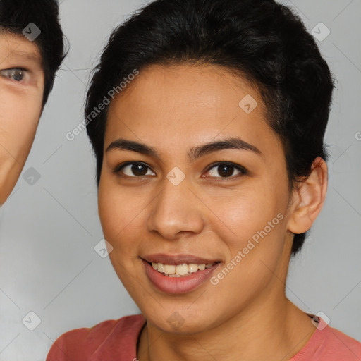 Joyful latino young-adult female with short  brown hair and brown eyes