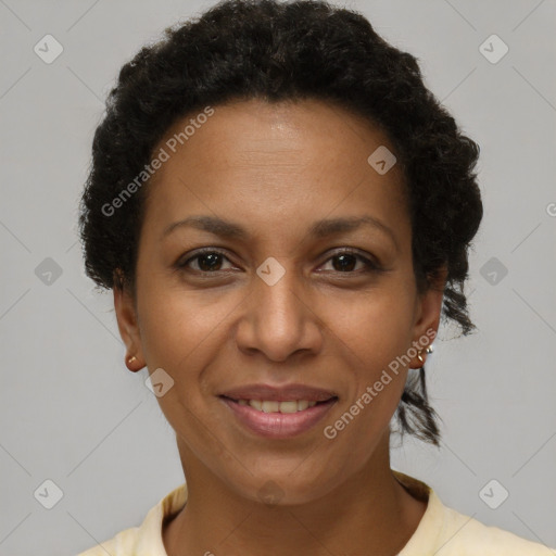 Joyful black adult female with short  brown hair and brown eyes