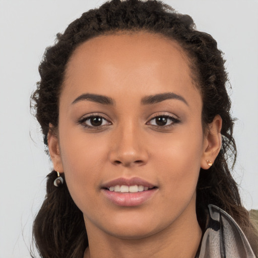 Joyful white young-adult female with long  brown hair and brown eyes