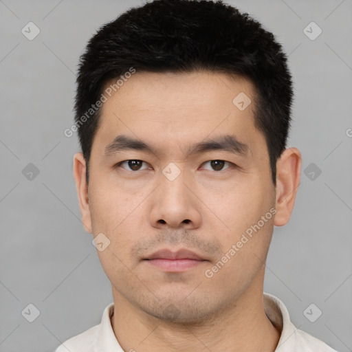 Neutral asian young-adult male with short  black hair and brown eyes