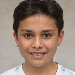 Joyful white child male with short  brown hair and brown eyes