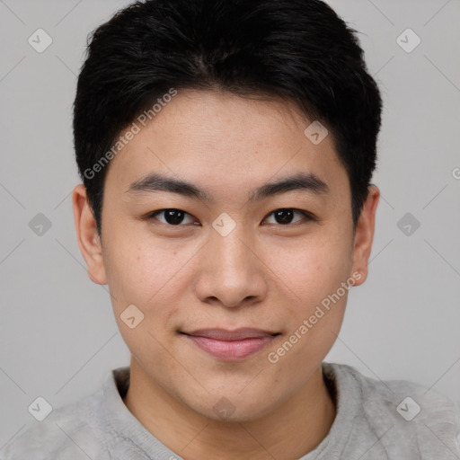 Joyful asian young-adult male with short  brown hair and brown eyes