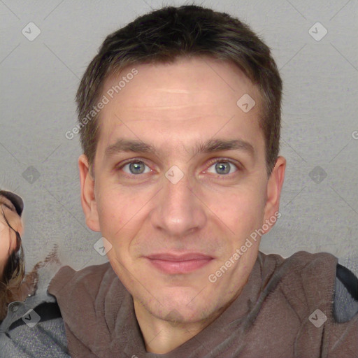 Joyful white adult male with short  brown hair and brown eyes