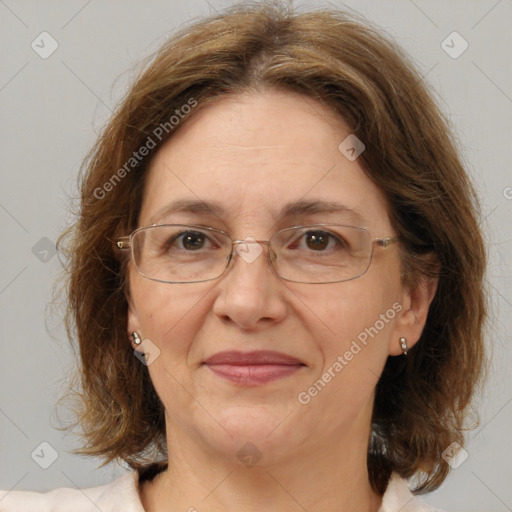 Joyful white adult female with medium  brown hair and green eyes