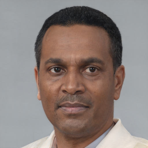 Neutral latino adult male with short  black hair and brown eyes